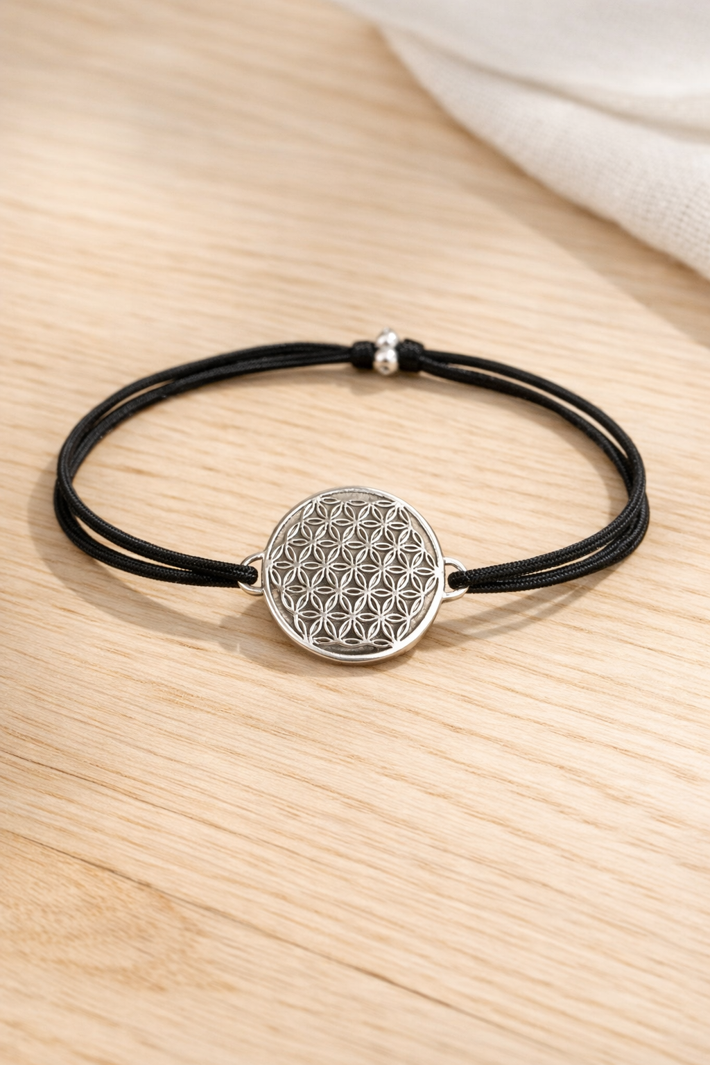 Armband Blume des Lebens in Silber und schwarzem Gummiband